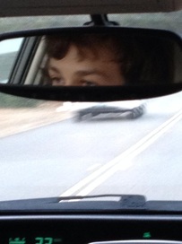 You can't see this, but it's a picture of me in a car's rear view mirror staring intensely.